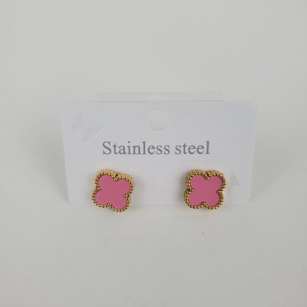 Earrings new with tags , stainless steel , color gold 7 pink